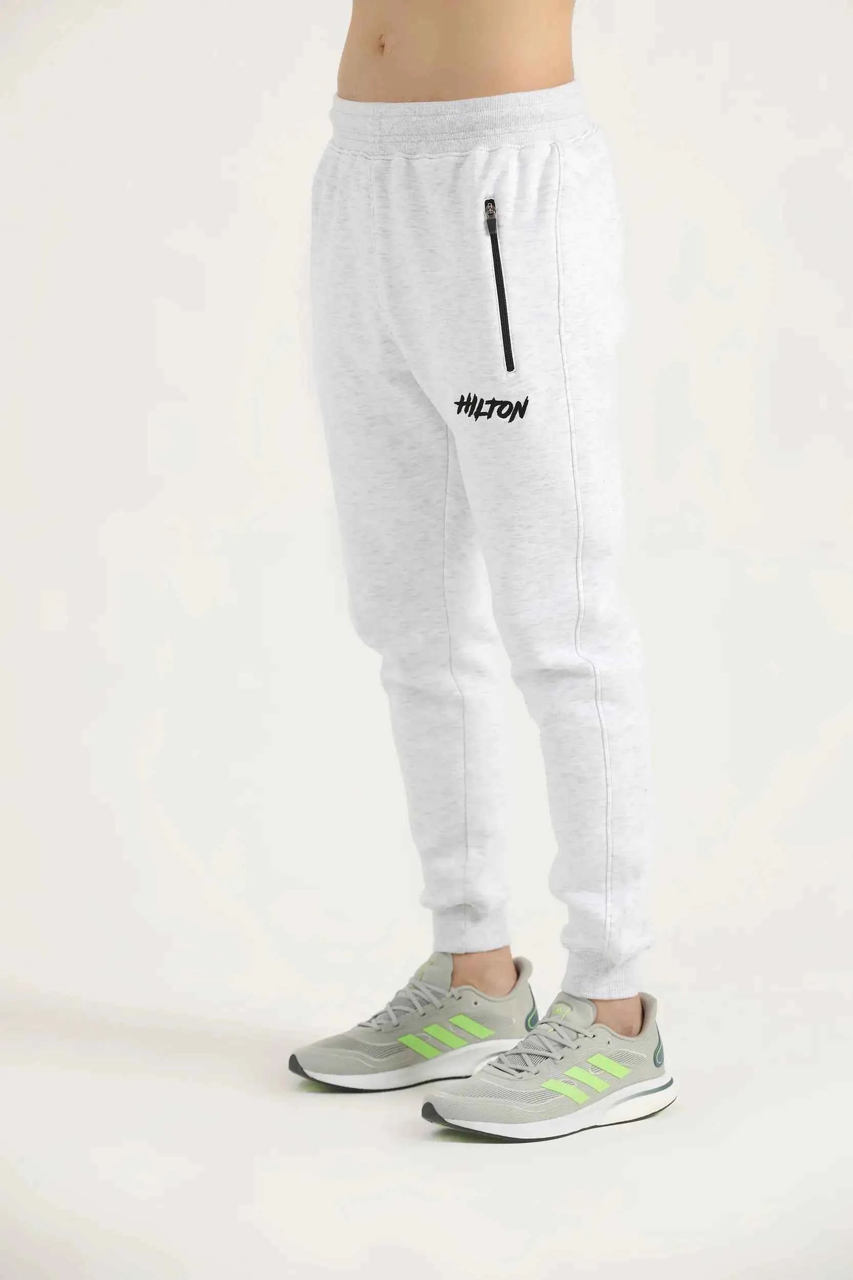Hilton Aesthetics Oatmeal Embroider Joggers side view in oatmeal with tapered fit and embroidered log