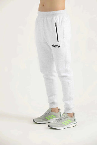 Hilton Aesthetics Oatmeal Embroider Joggers side view in oatmeal with tapered fit and embroidered log